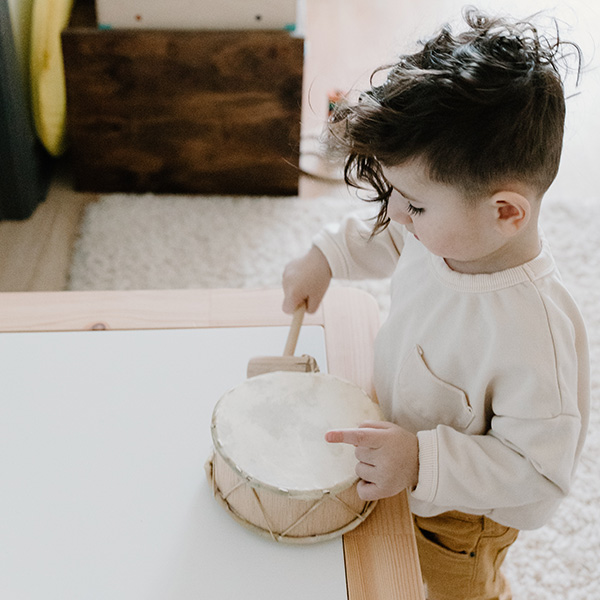 small kid playing drum